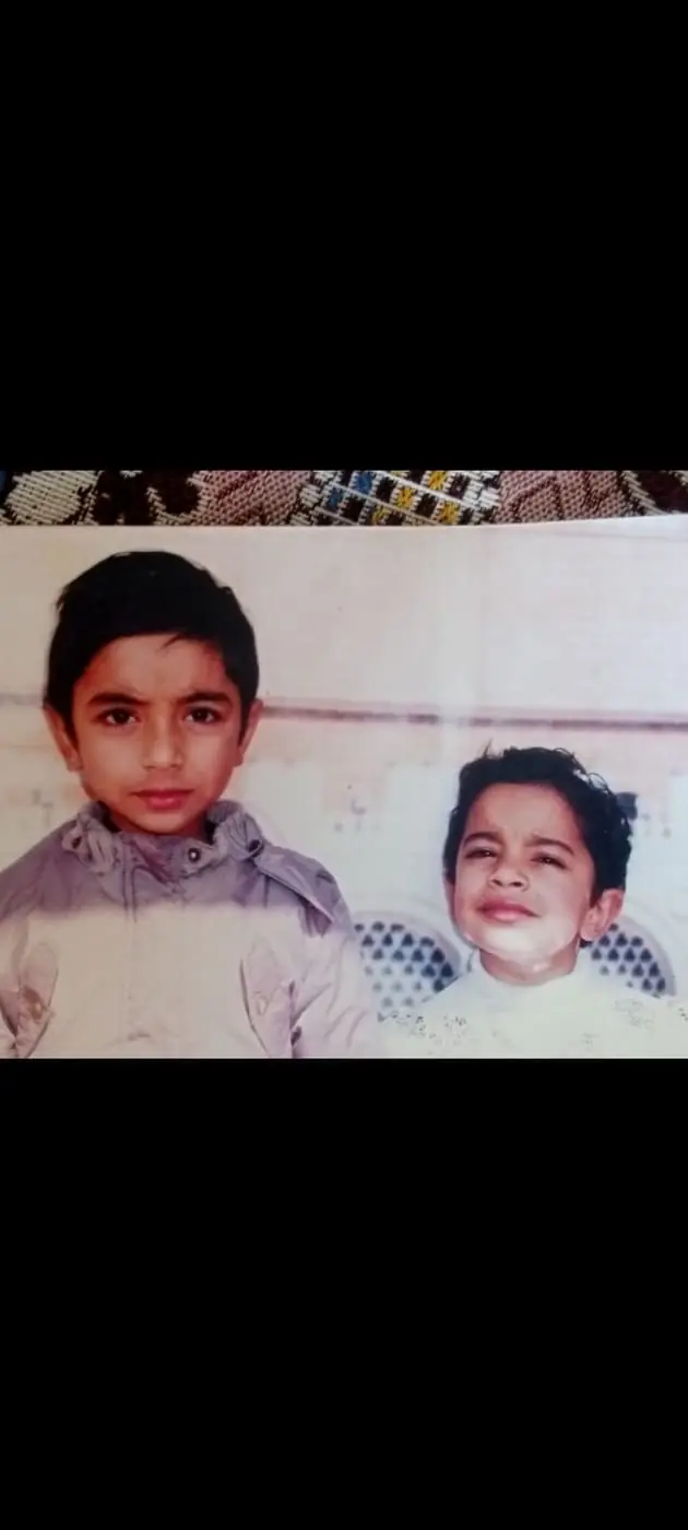 Two young boys standing together