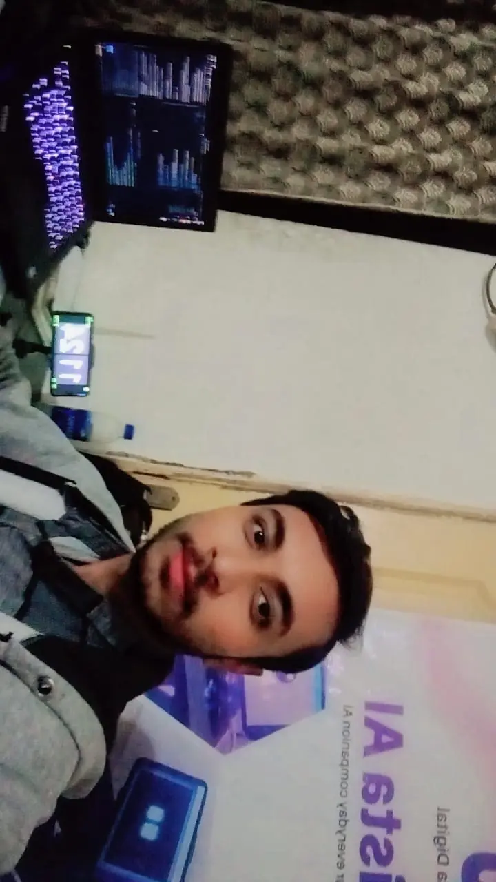 My coding workspace with monitors and an AI banner