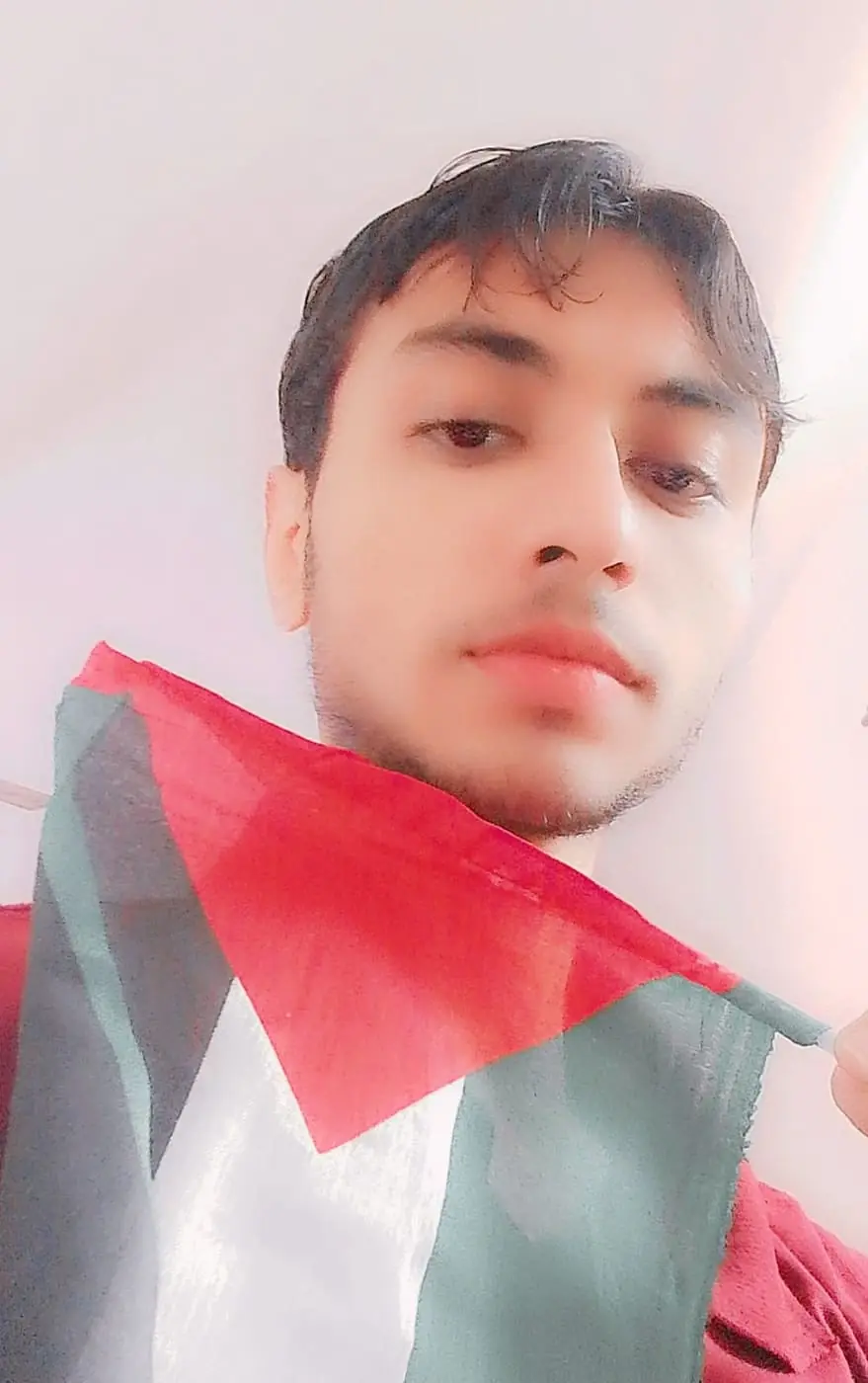 Portrait of me holding a Palestinian flag
